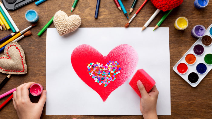 A burst of vibrant colors created with sponge painting or stickers, giving the card a playful and artistic vibe.