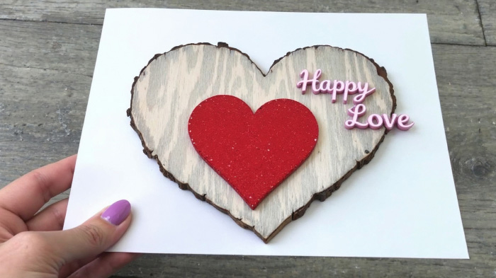 A thin wooden accent or faux wood texture glued onto the card, giving it a warm, handcrafted feel.