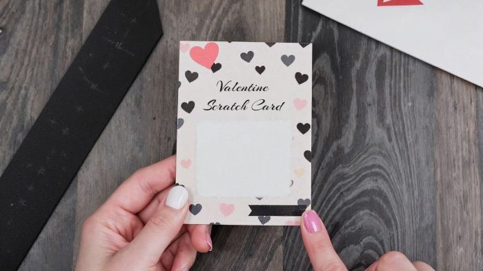 A DIY scratch-off card with a hidden heartfelt message underneath, making the recipient excited to uncover your love.