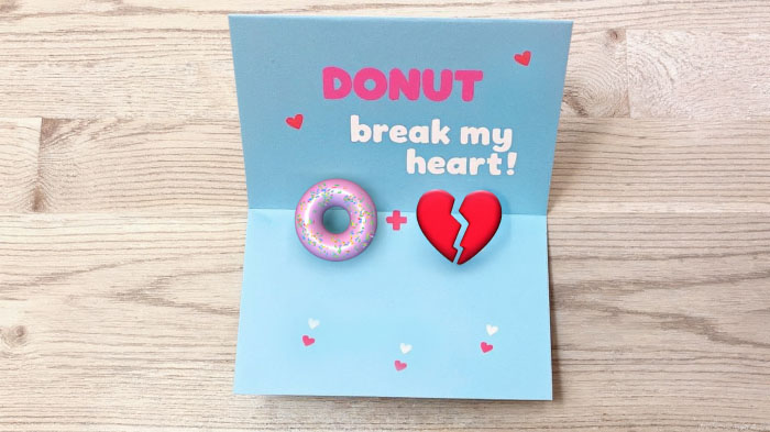 A playful twist using images instead of words, saying “Donut Break My Heart