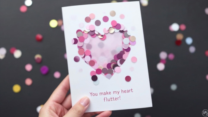 Pink confetti sealed between clear plastic layers, creating a fun, interactive card that shimmers when shaken.