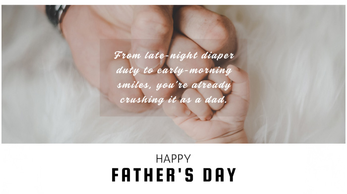 A Father’s Day card for a new dad with a photo of a father and a newborn fist-bumping each other and a message.