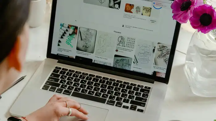 A simple photo of a person editing a photo on their laptop.