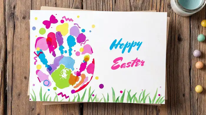 Fistprint Easter egg card with colorful paint and hand-drawn patterns.