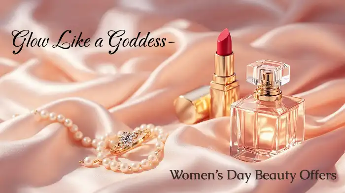 Close-up of red lipstick and a perfume on silky satin fabric with rose gold and pearl accents.