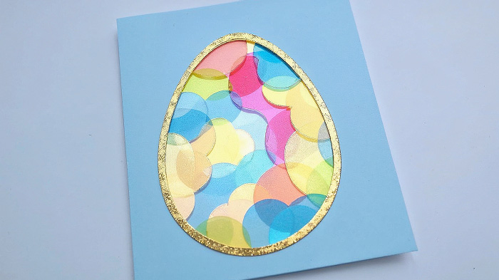 Suncatcher Easter egg card with colored cellophane for a glowing effect.