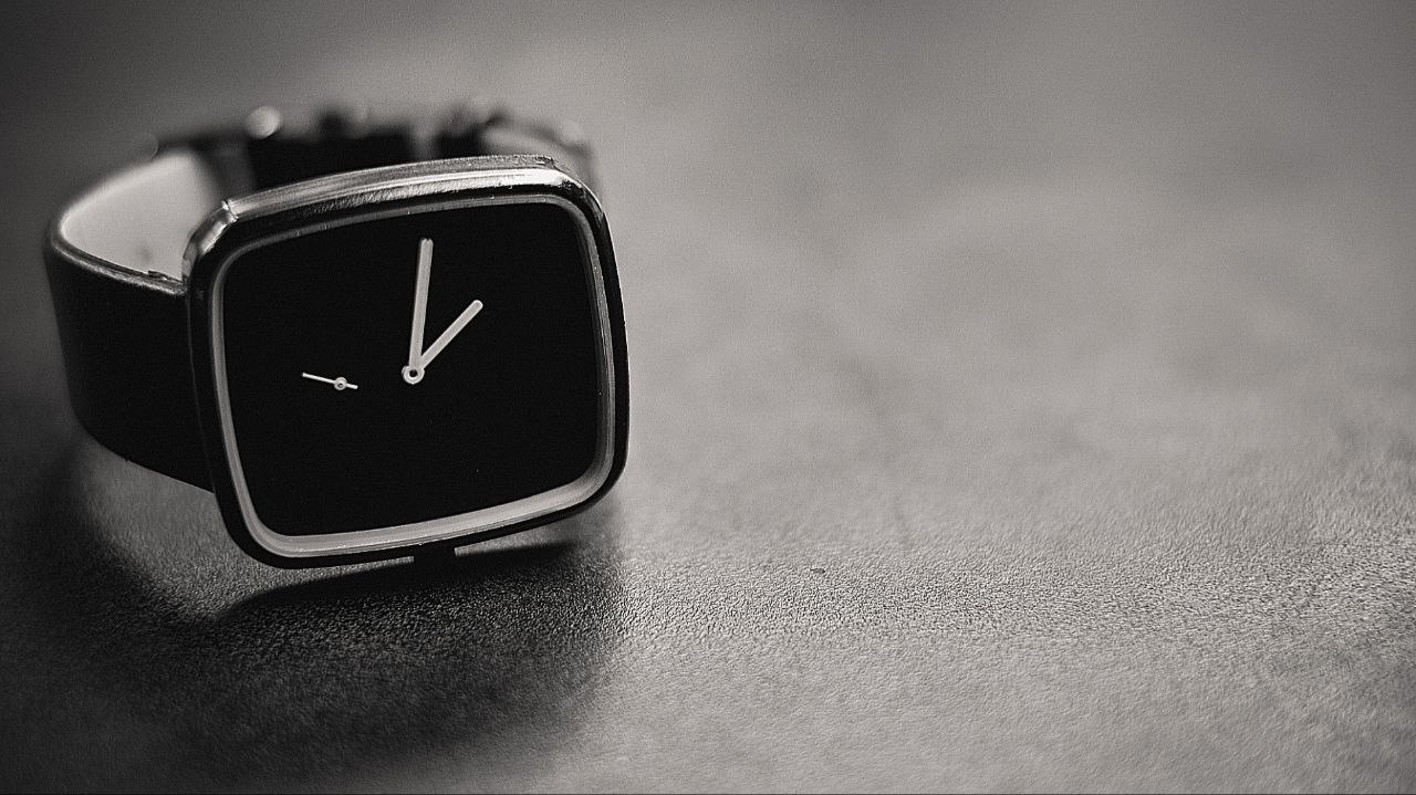 A close-up shot of a minimal wristwatch