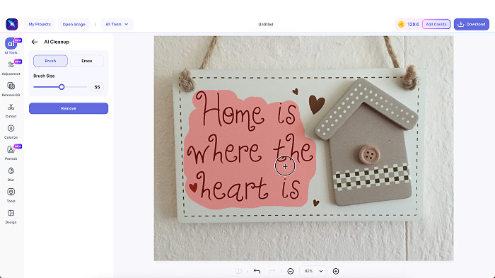 A screenshot of LightX’s Cleanup Picture tool with masked text in the image and refining tools. 
