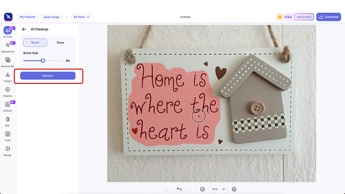 A screenshot of LightX’s Cleanup Picture tool with masked text in the image and the Remove button selected. 